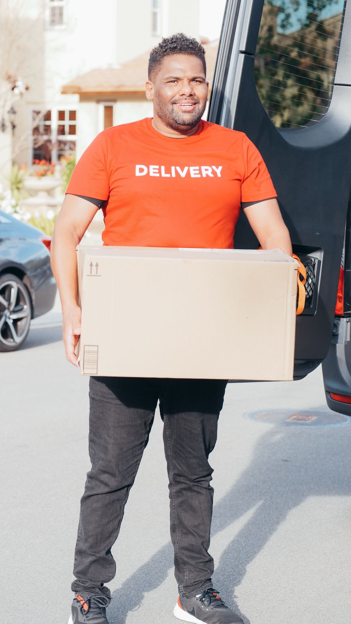 Zango Jango courier making a delivery from the courier vehicle