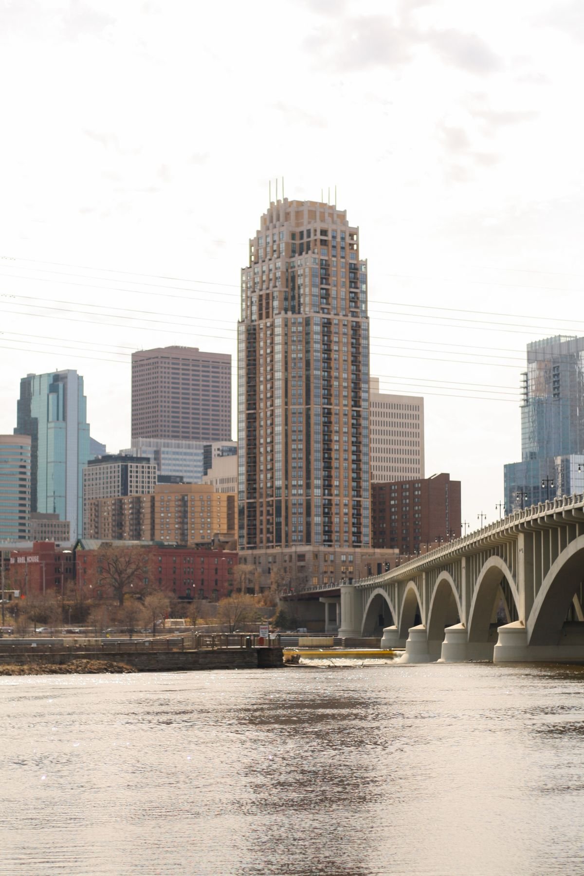 Minneapolis skyline along the Mississippi river at sunrise